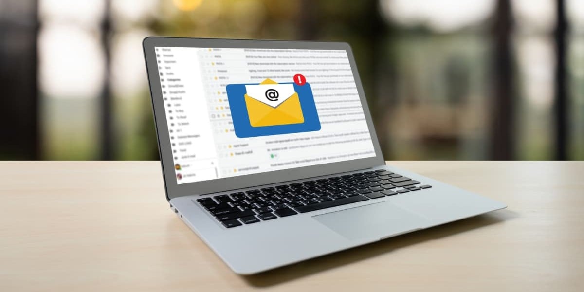 An open laptop computer showing an email inbox | THAT Agency of South Florida